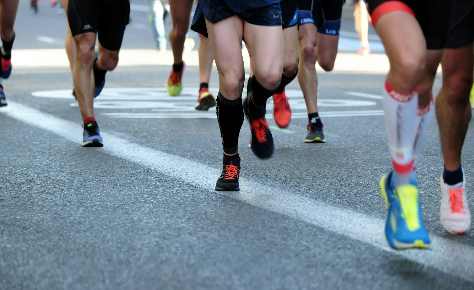 Runners on an asphalt road