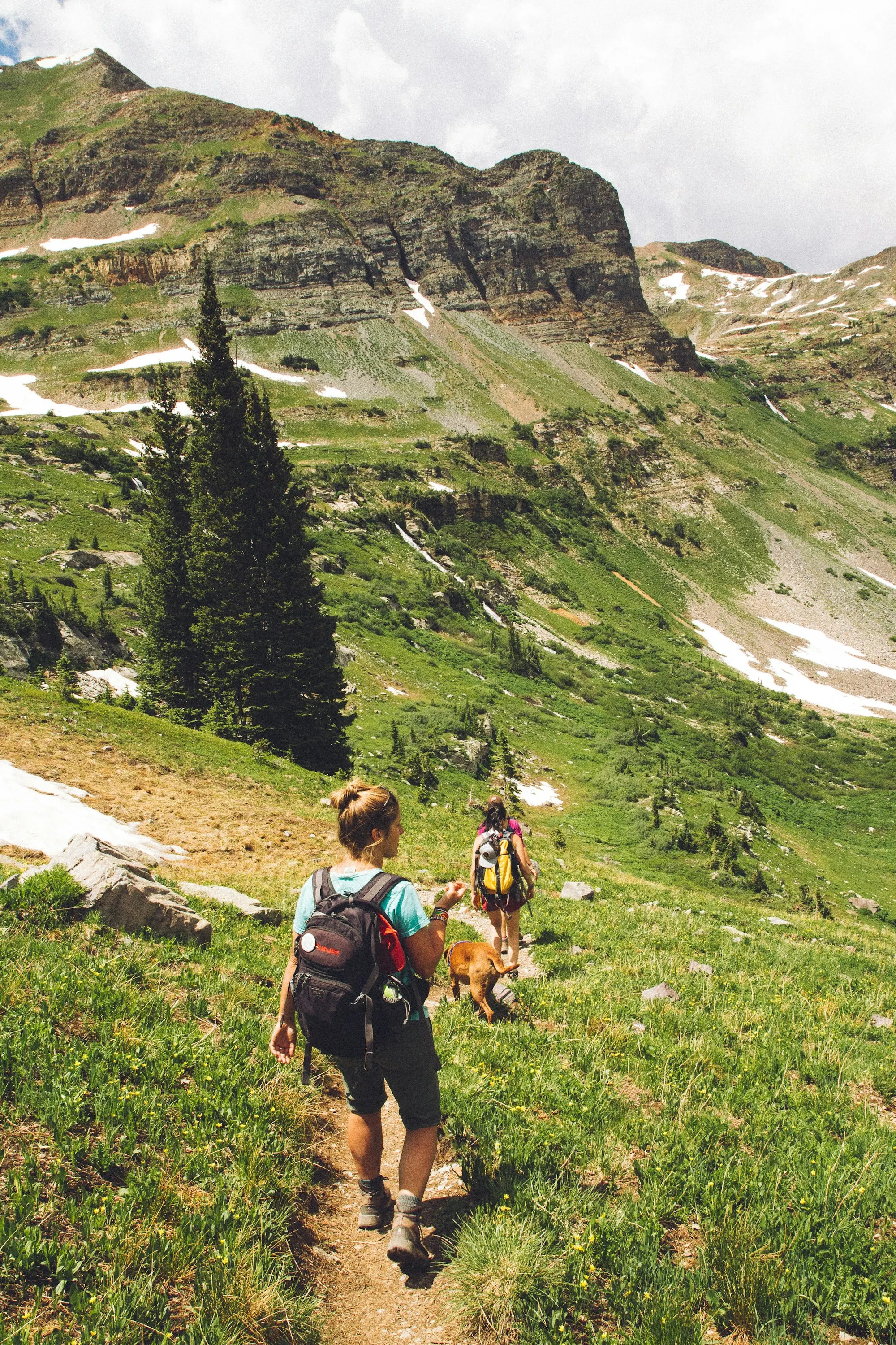 Two women hiking a mountain trail
