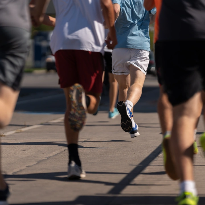 Runners on a road, seen from behind